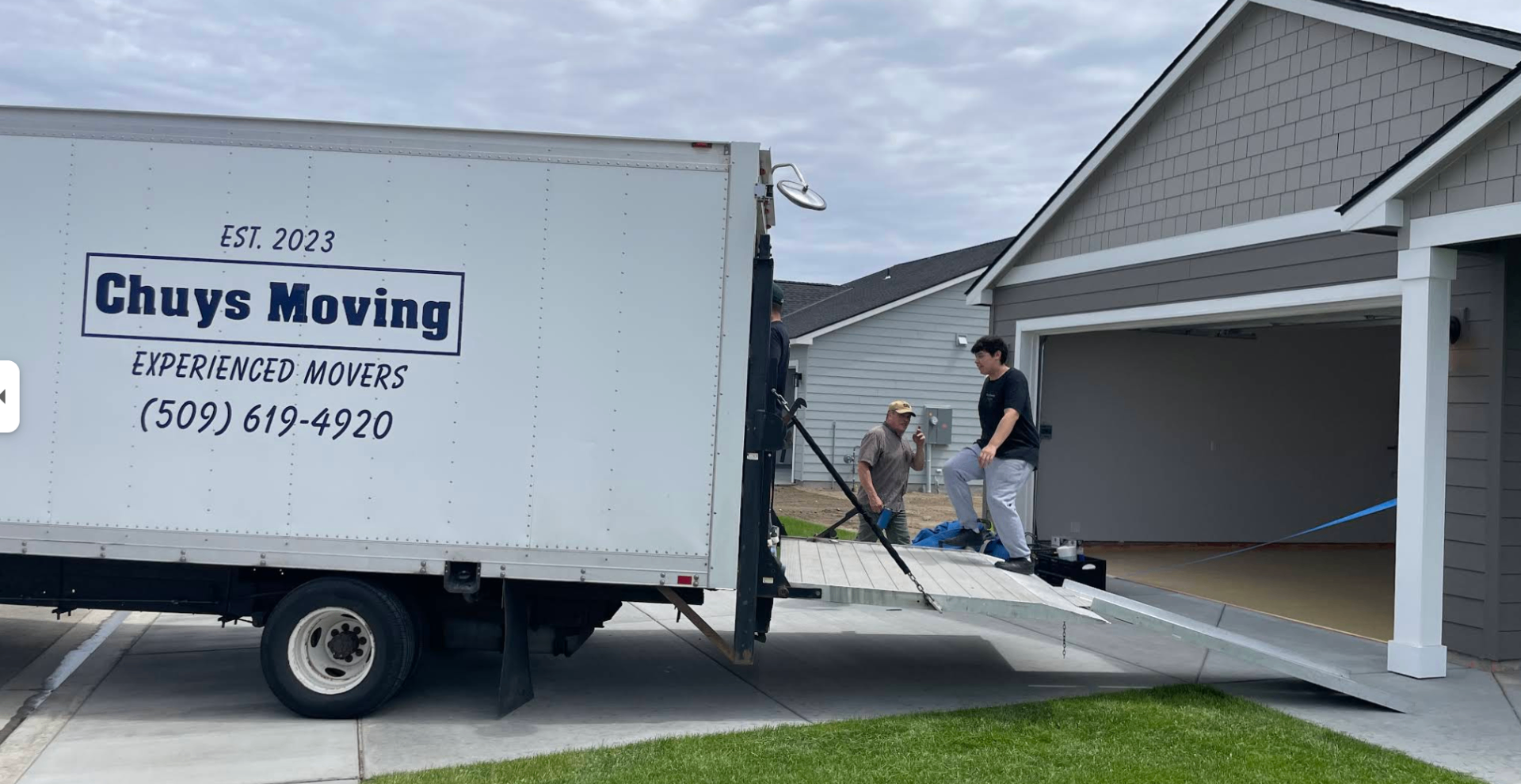 Chuy's Moving truck parked at a customer's home during a residential move in the Tri-Cities