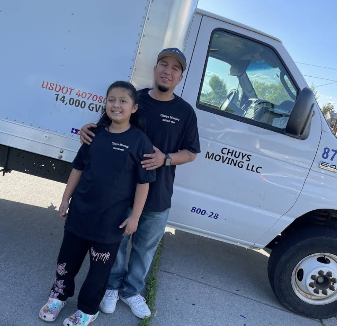 Chuy's Moving family-owned team standing beside the company truck